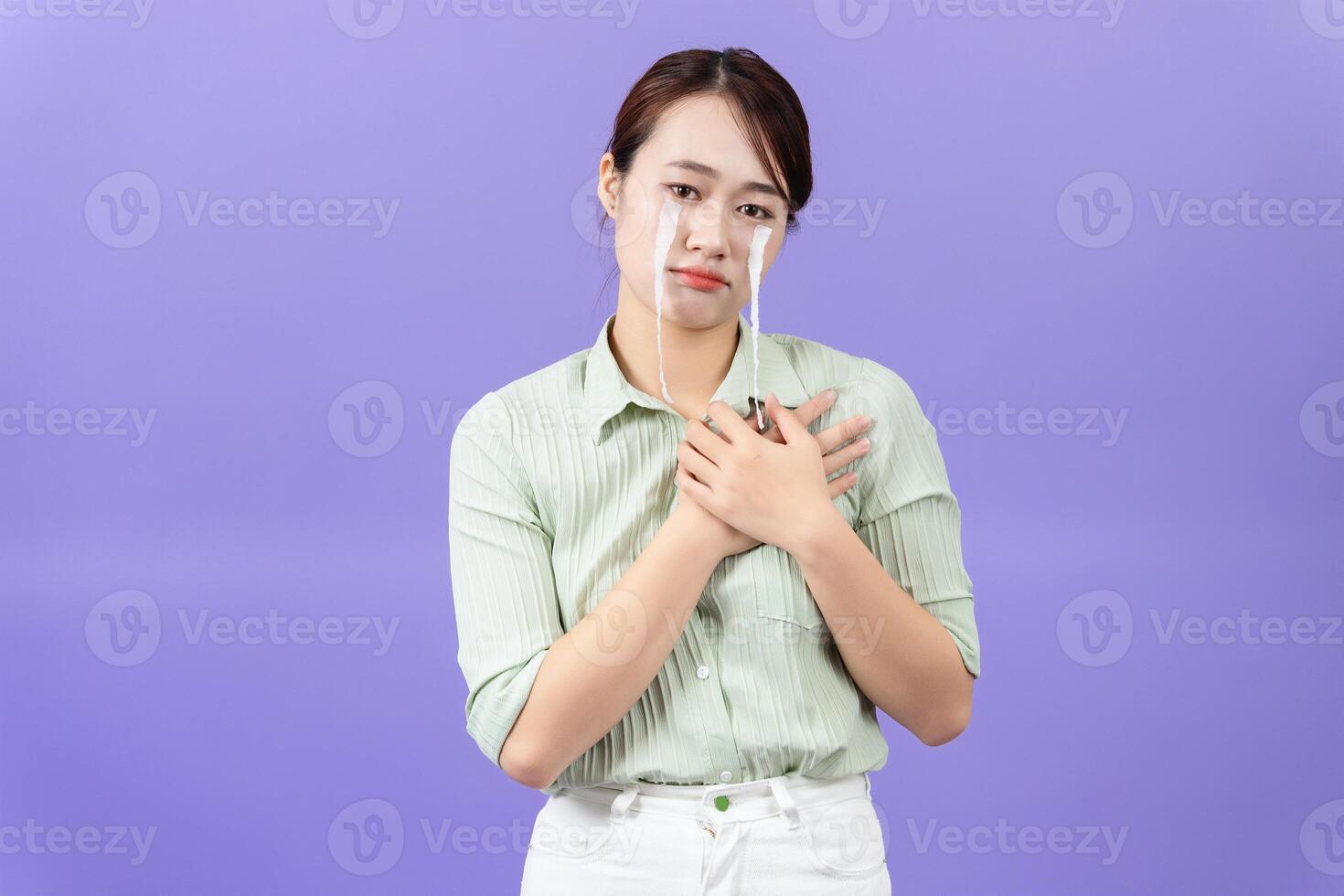 Photo of young Asian woman on purple background