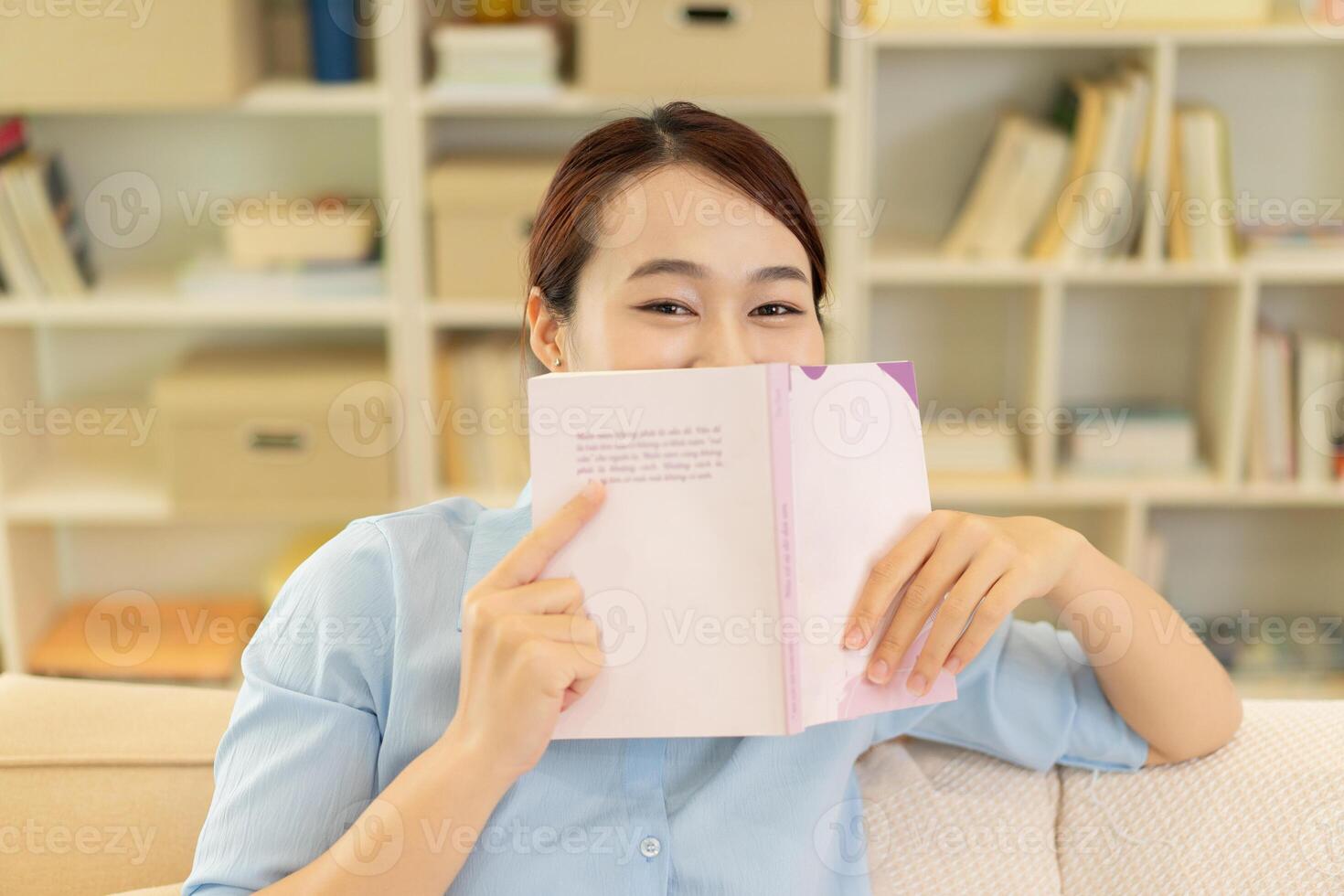 Photo of young Asian woman at home