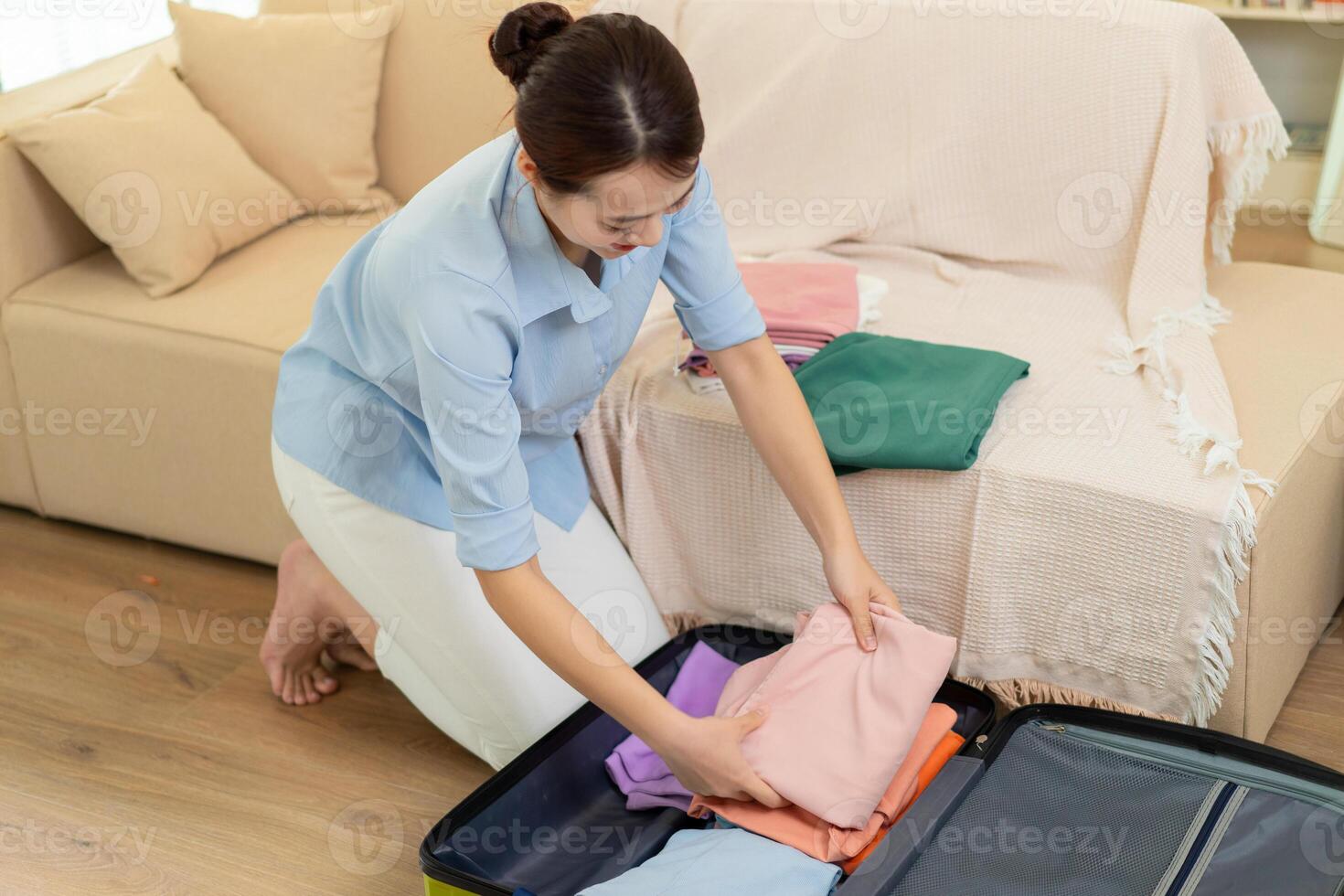 Photo of young Asian woman at home