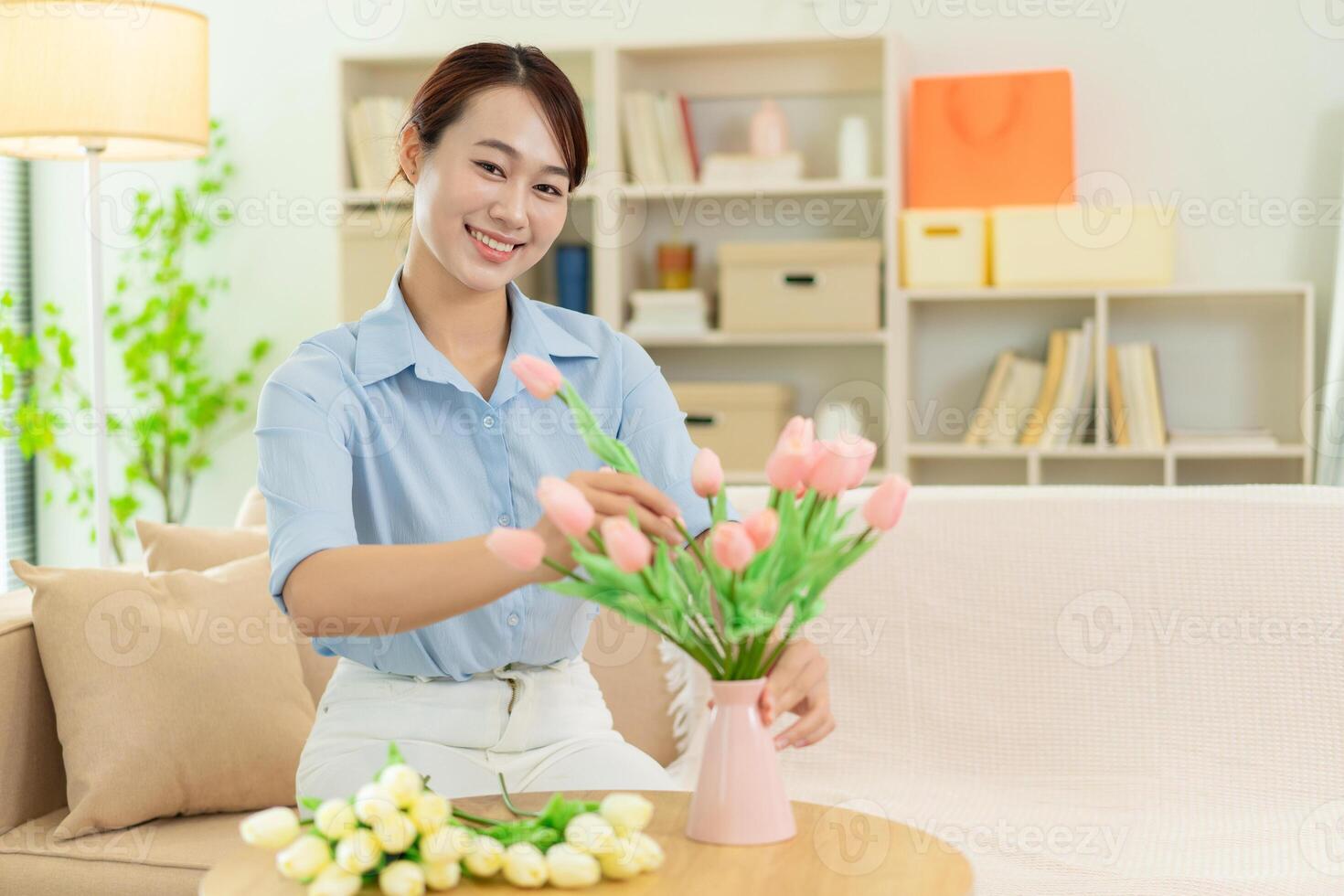 Photo of young Asian woman at home