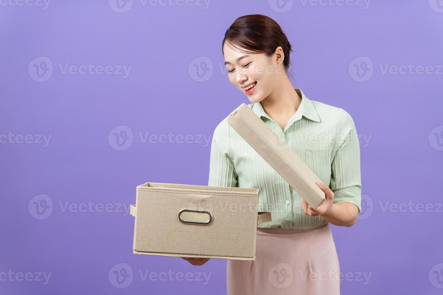 Photo of young Asian woman on purple background