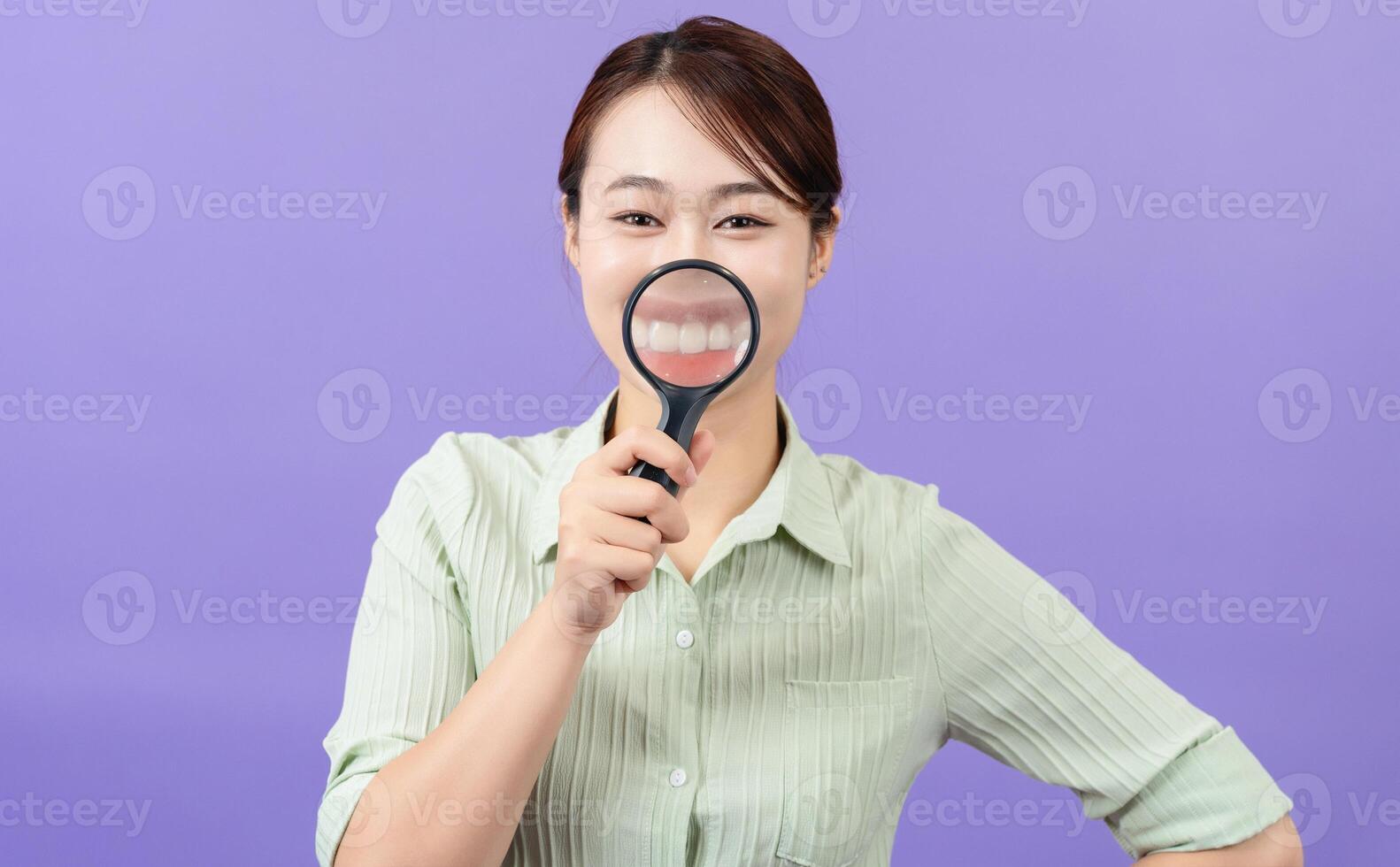 Photo of young Asian woman on purple background