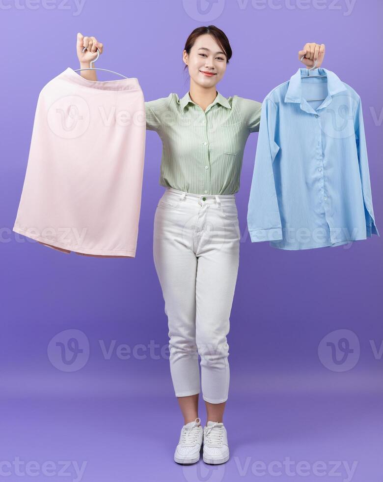 Photo of young Asian woman on purple background