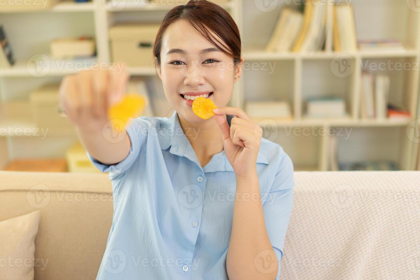 Photo of young Asian woman at home