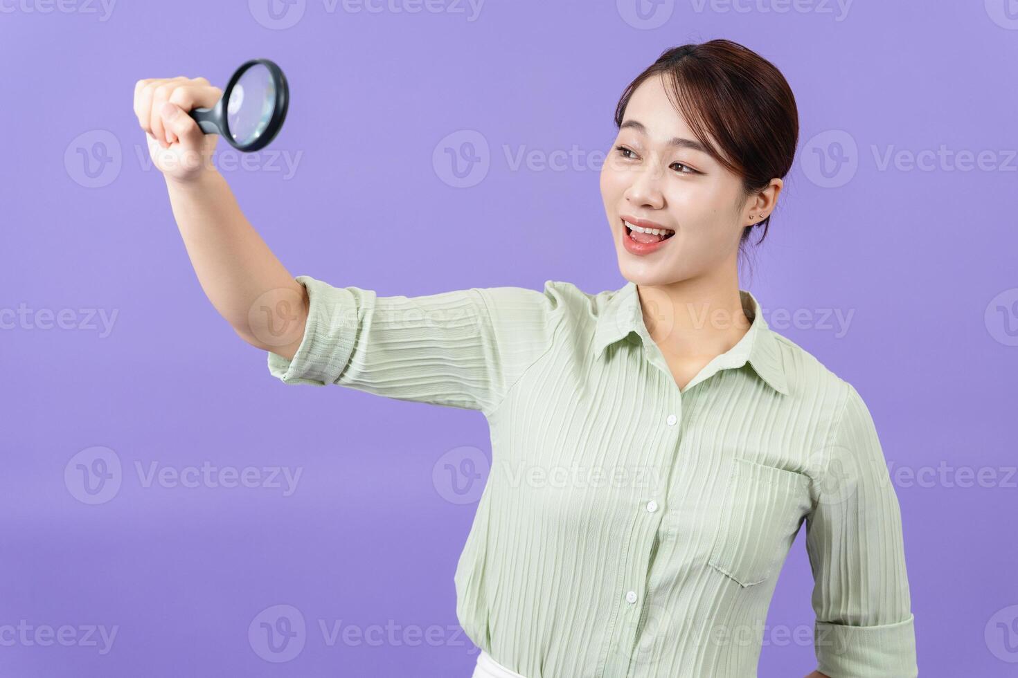 Photo of young Asian woman on purple background