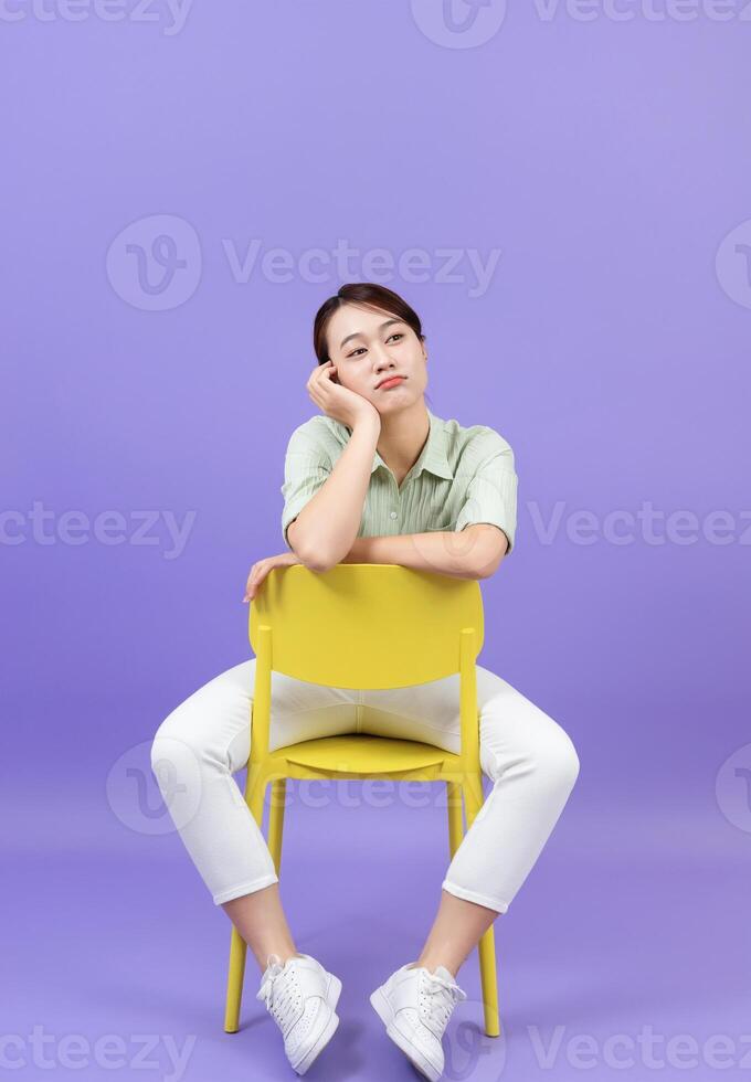 Photo of young Asian woman on purple background