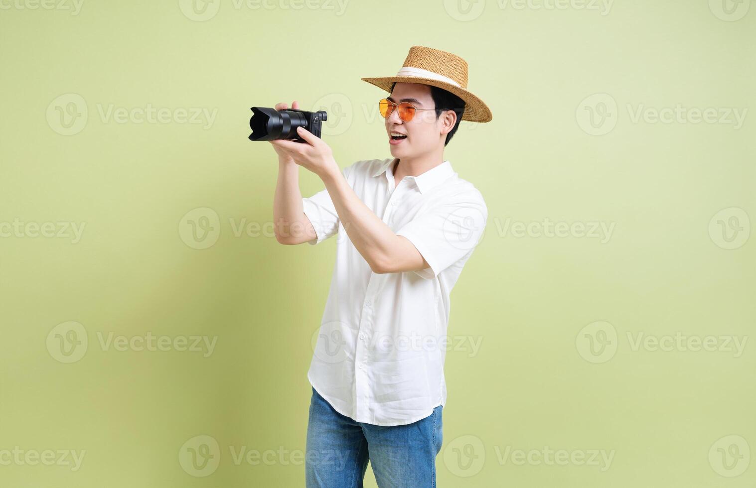 Photo of young Asian man on green background