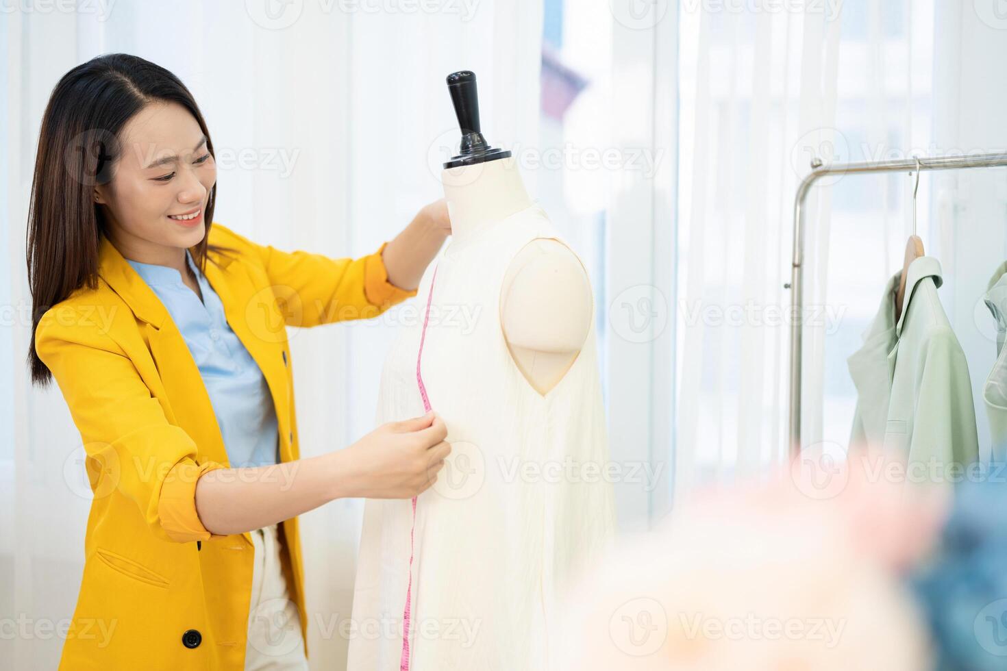 Photo of young Asian female fashion designer