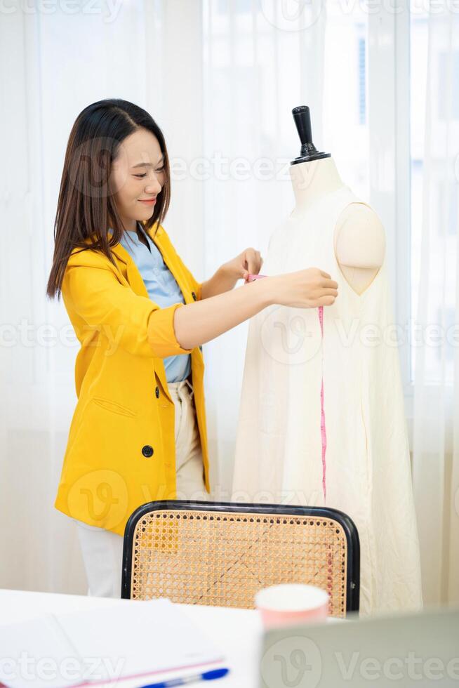 Photo of young Asian female fashion designer