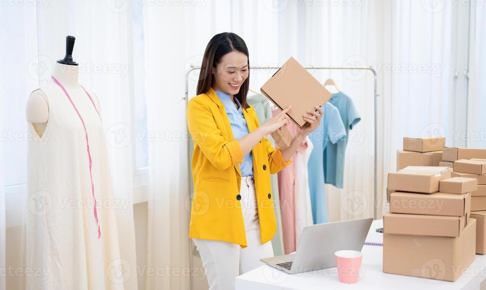 Photo of young Asian woman selling online