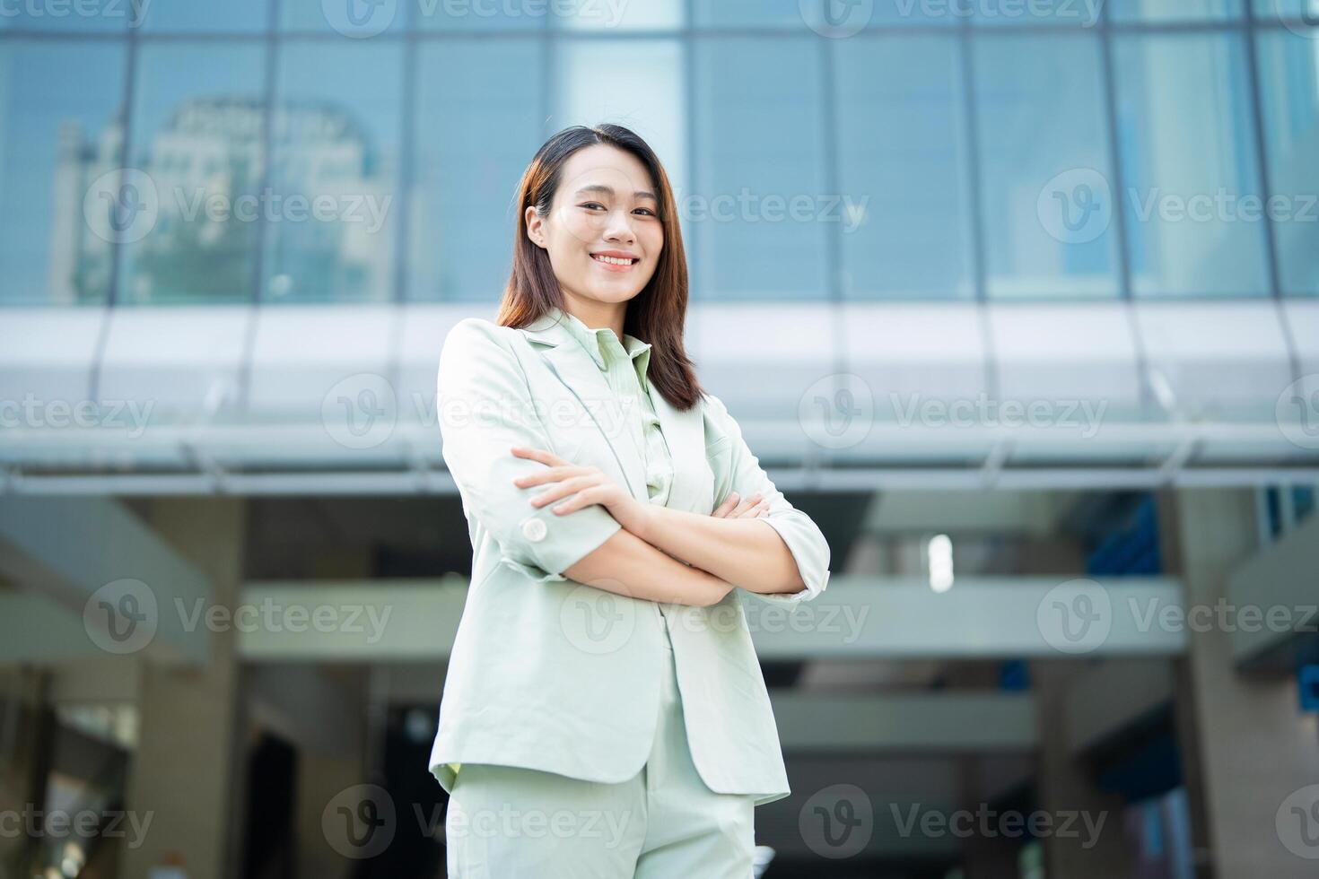 Portrait of young Asian businesswoman outside the office photo