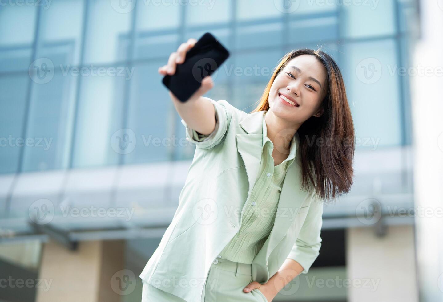 Portrait of young Asian businesswoman outside the office photo