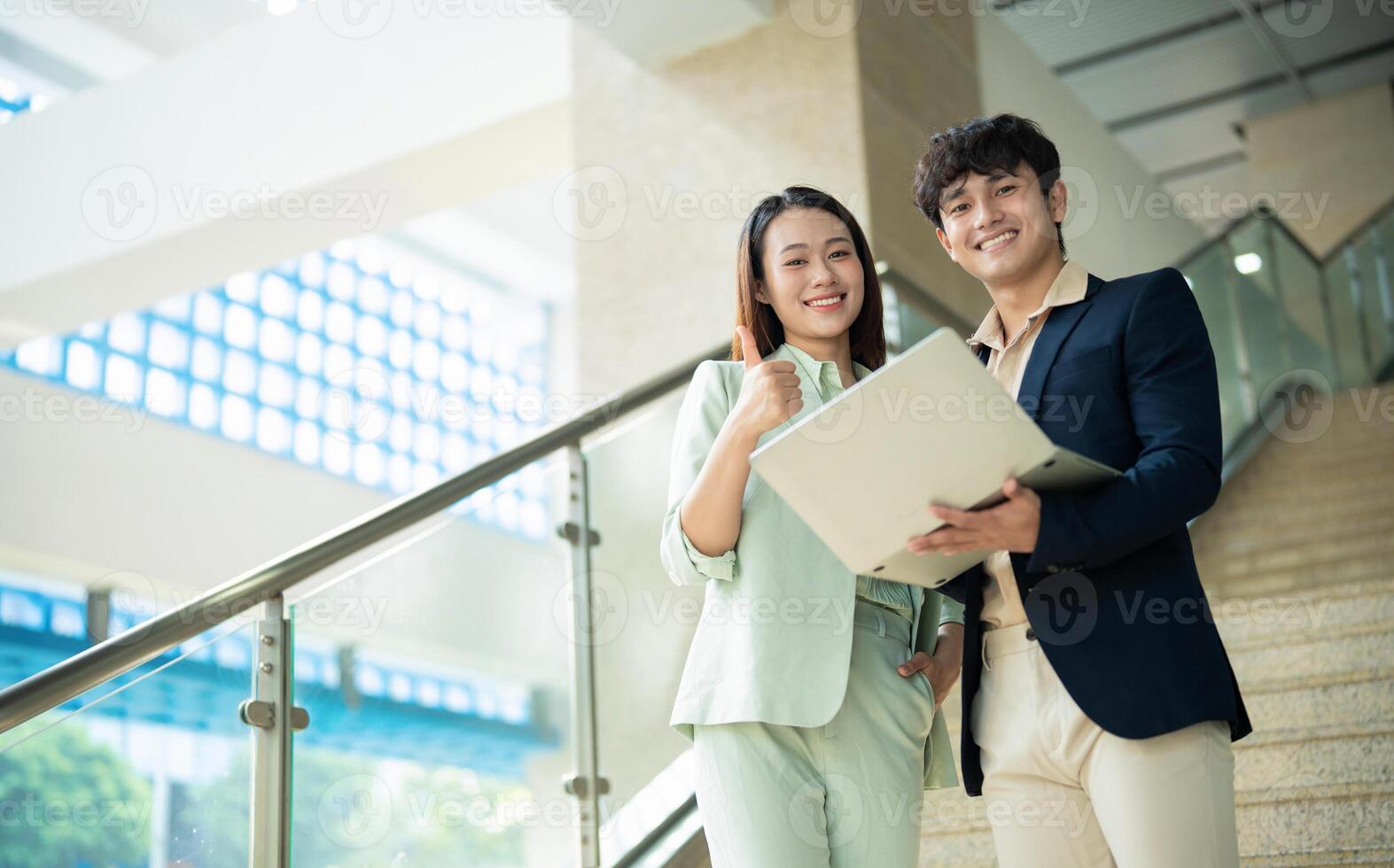 Photo of two young Asian businesspeople