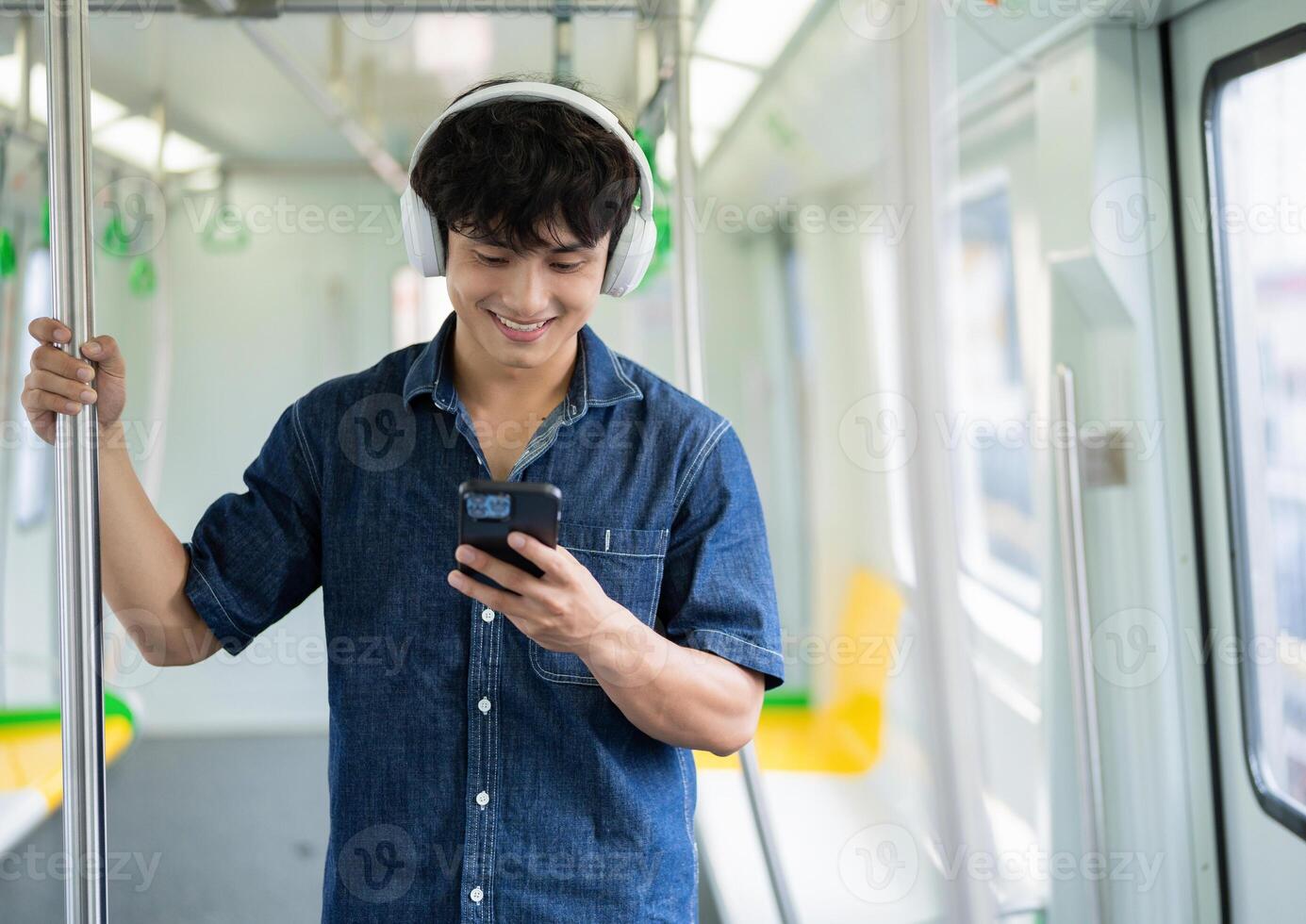 Young Asian man on the metro photo