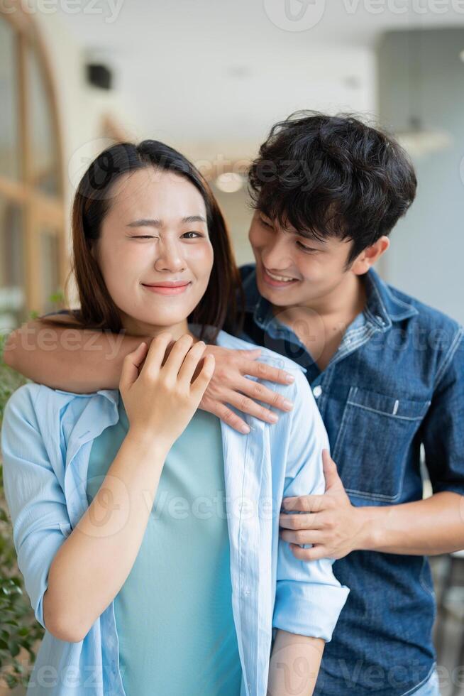 Photo of young Asian couple hang out together