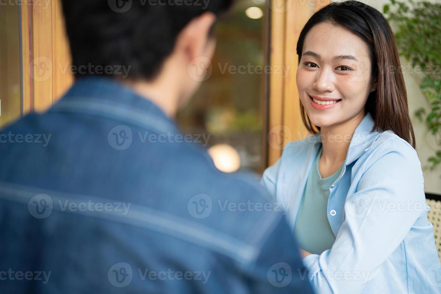 Photo of young Asian couple hang out together