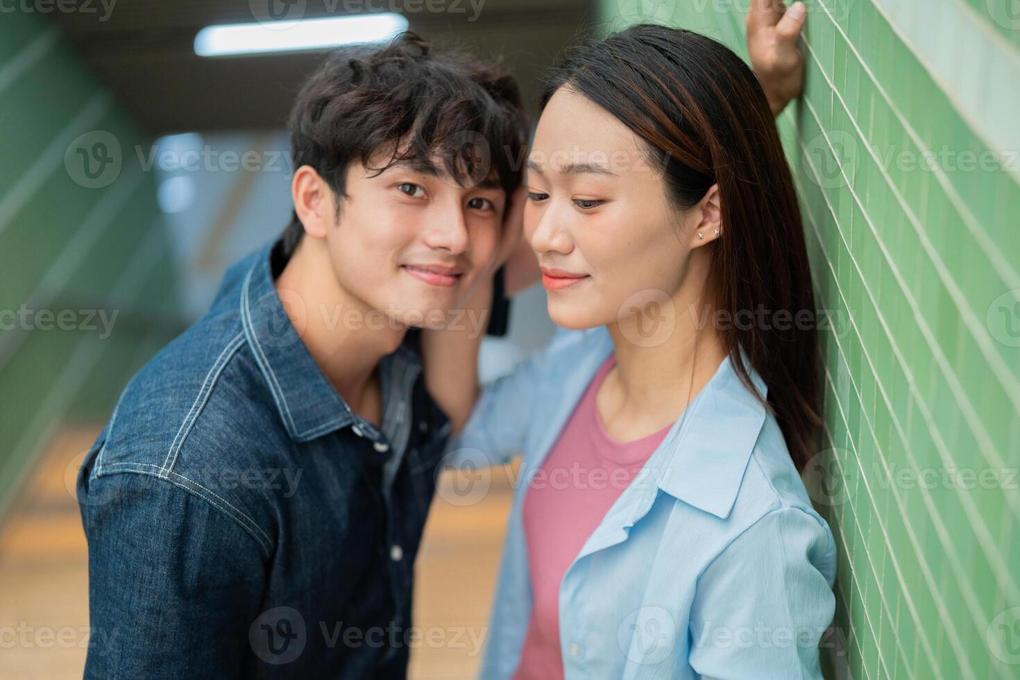Photo of young Asian couple hang out together