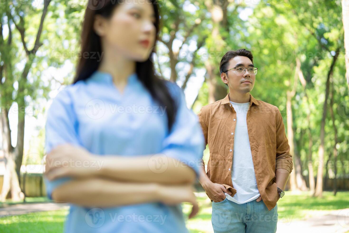 Photo of young Asian couple at park