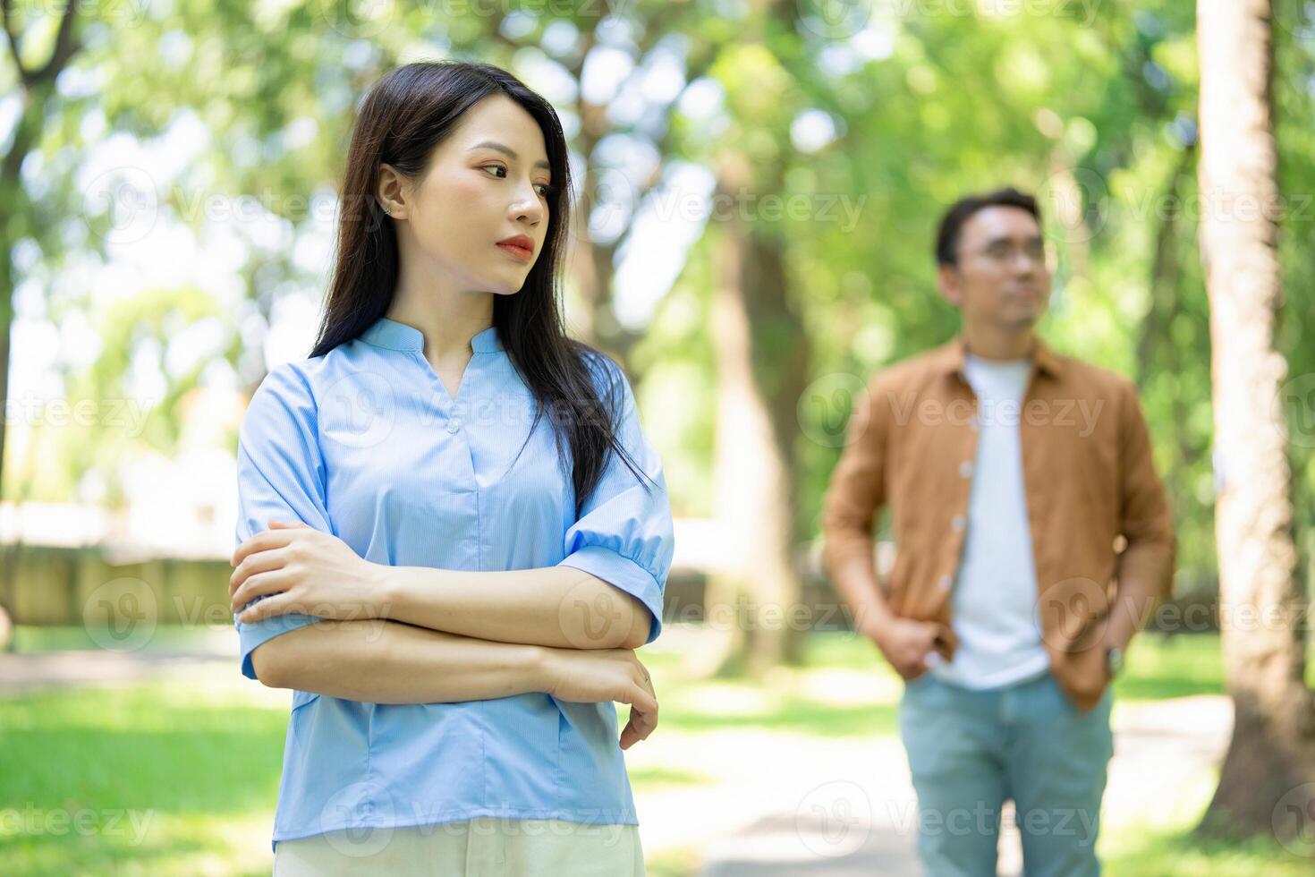 Photo of young Asian couple at park