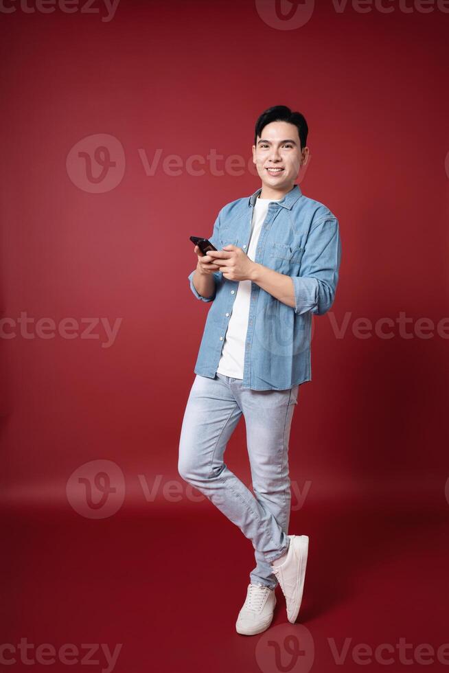 Photo of young Asian man on background