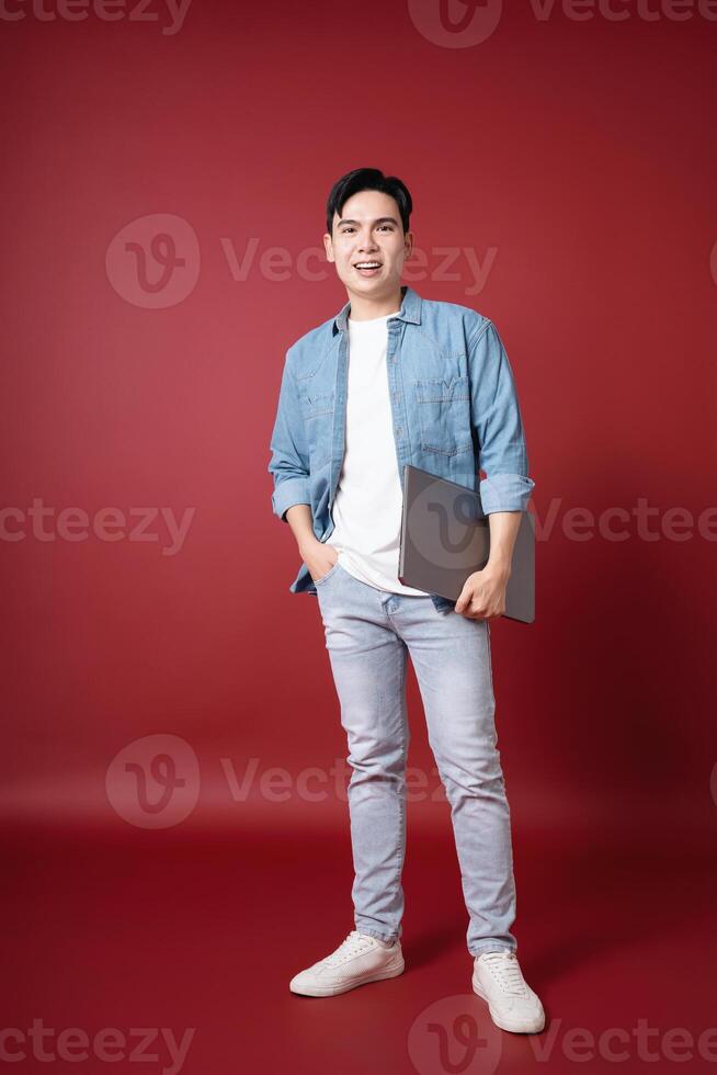 Photo of young Asian man on background