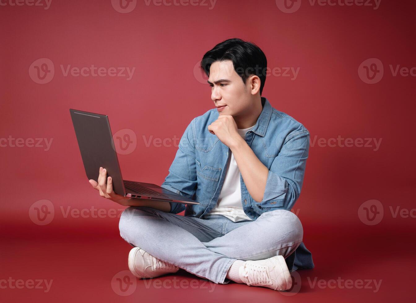Photo of young Asian man on background