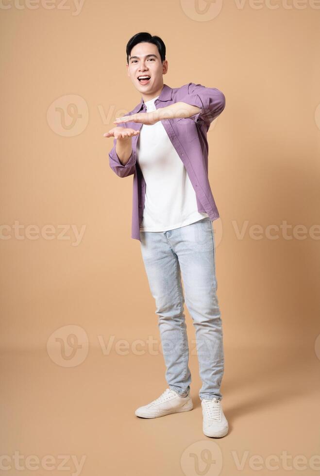 Photo of young Asian man on background