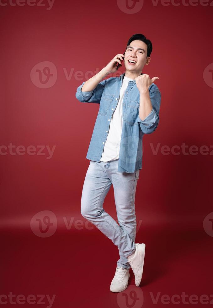 Photo of young Asian man on background