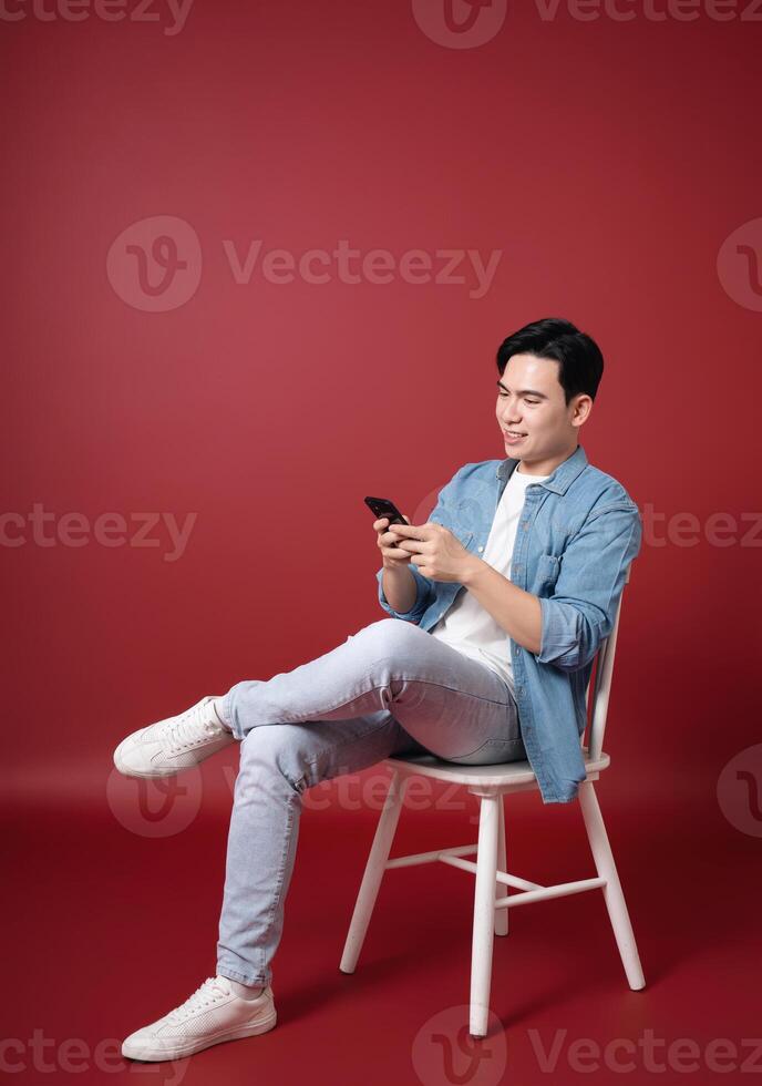 Photo of young Asian man on background