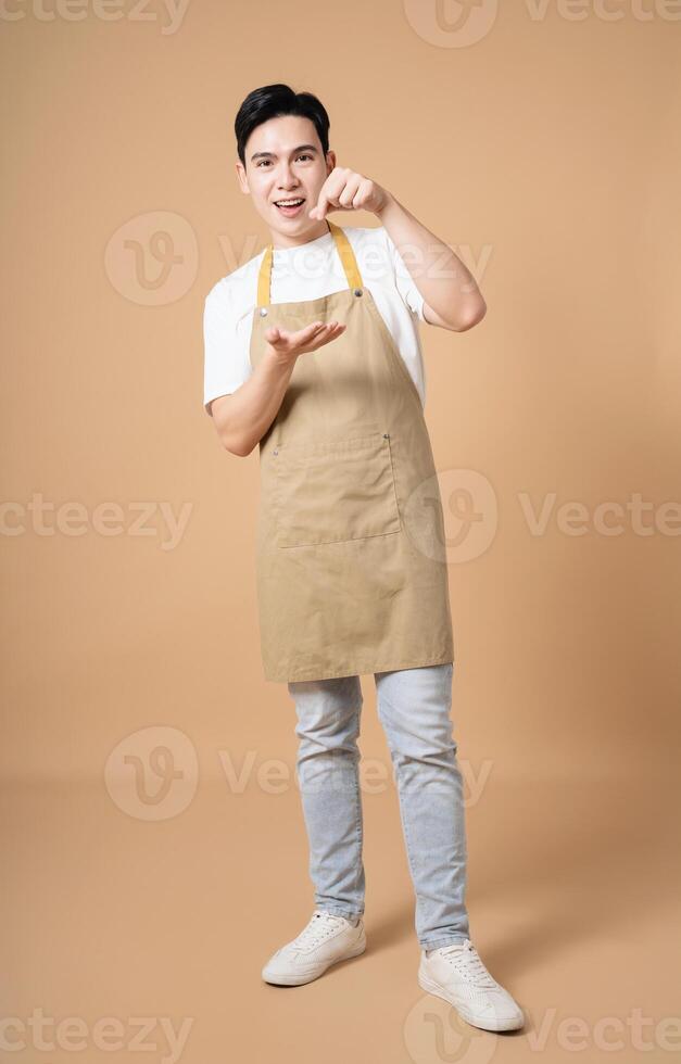 Photo of young Asian man on background