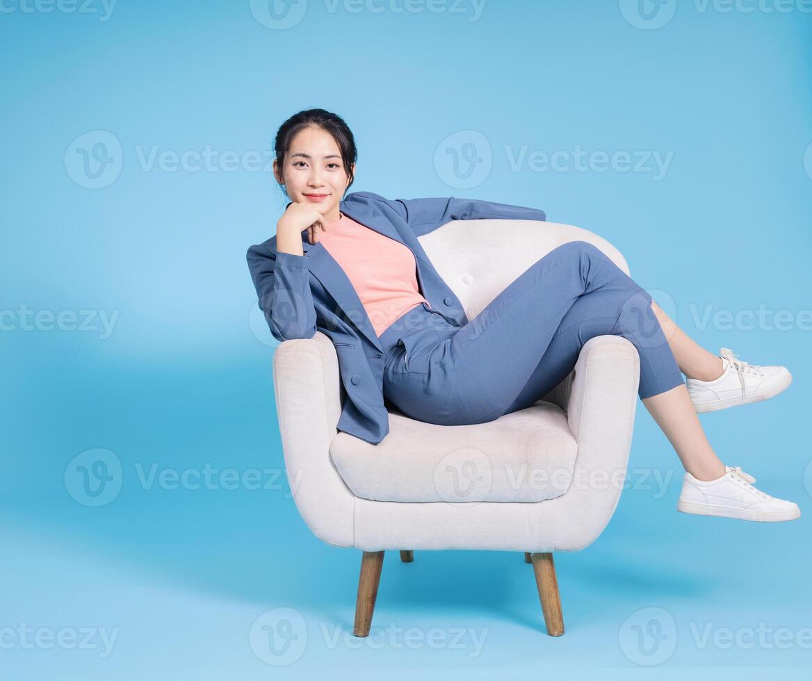 Photo of young Asian businesswoman on background