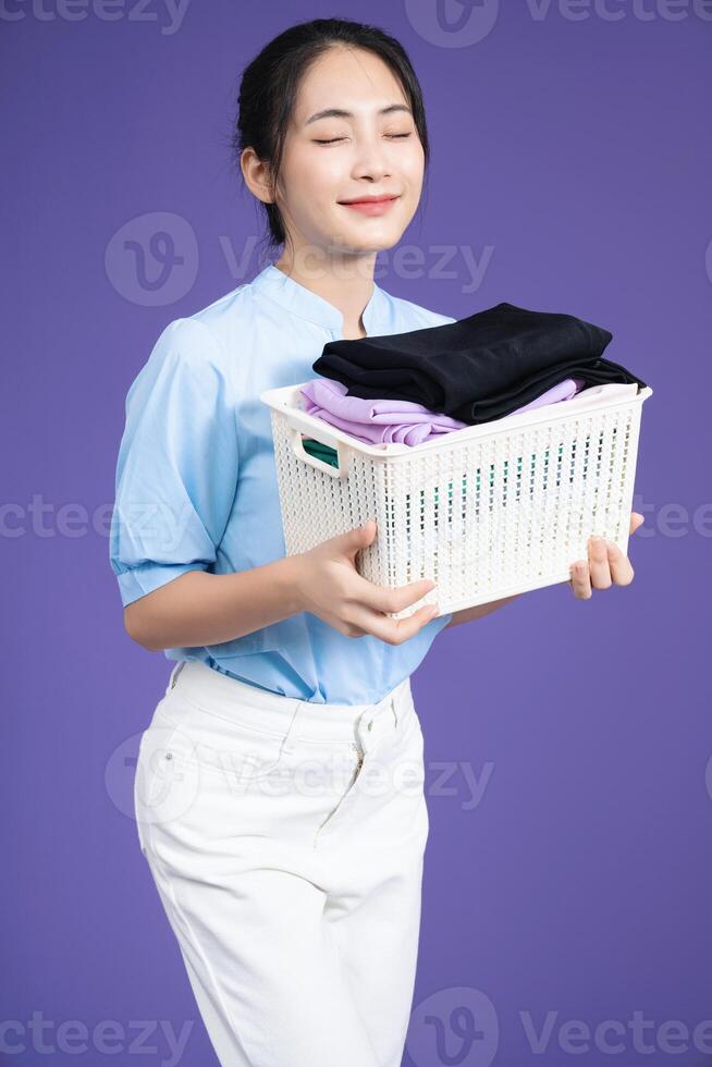 Image of young Asian woman on background photo