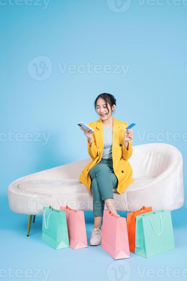 Photo of young Asian businesswoman on background