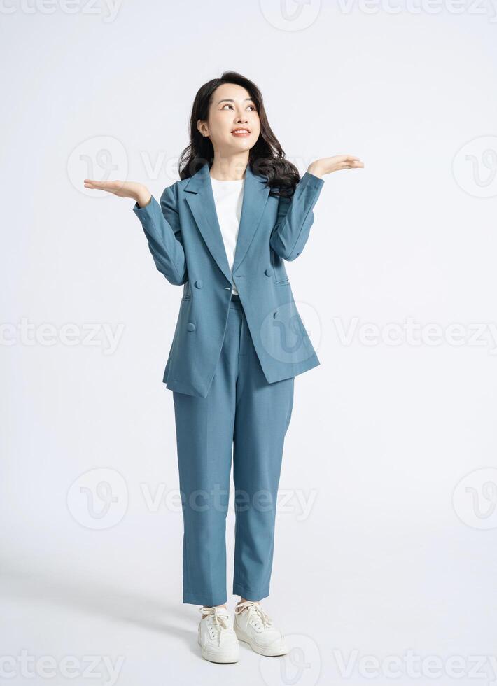 Image of young Asian business woman on background photo