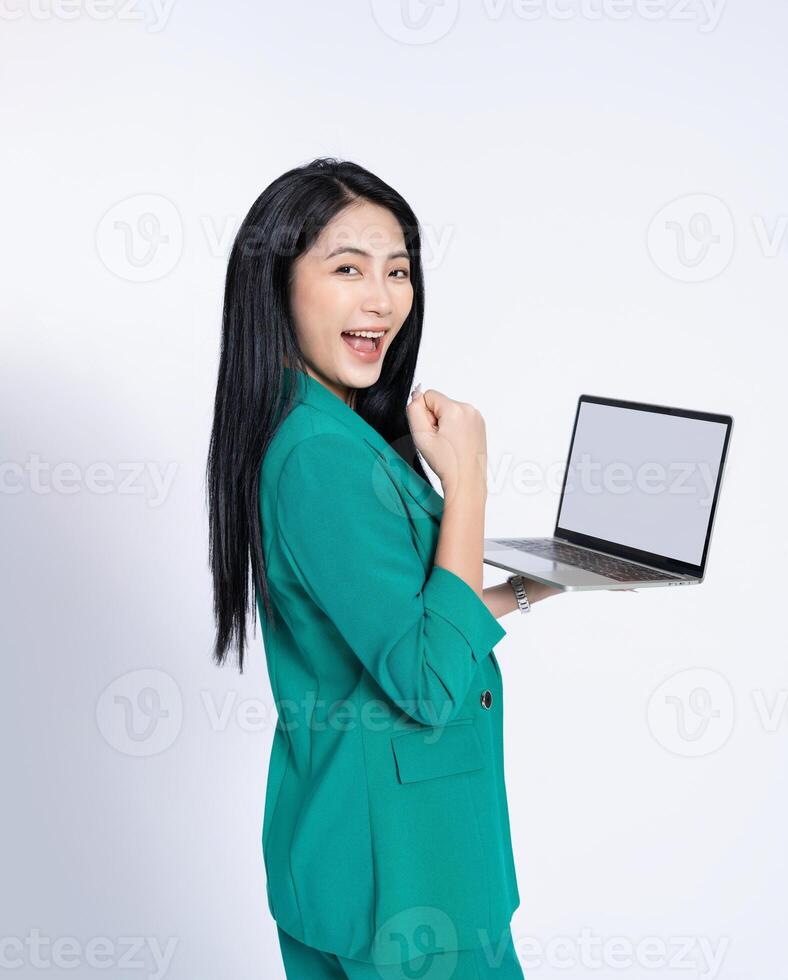 Portrait of young Asian business woman on white background photo