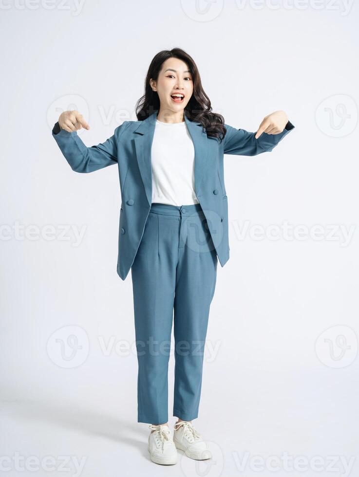 Image of young Asian business woman on background photo