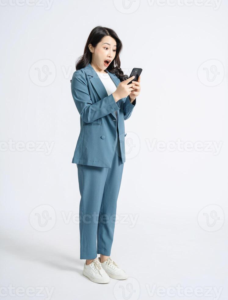 Image of young Asian business woman on background photo