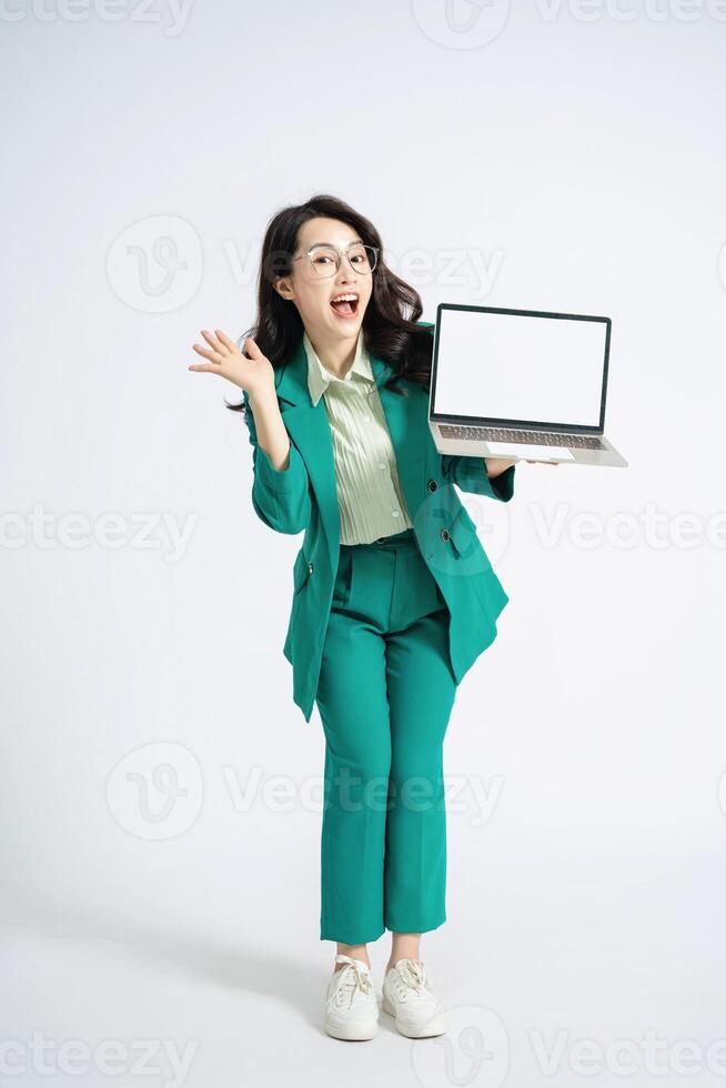 Image of young Asian business woman on background photo