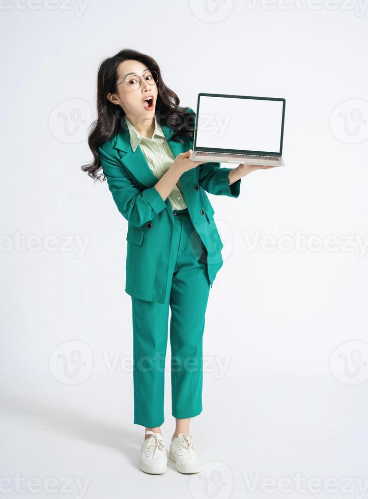 Image of young Asian business woman on background photo