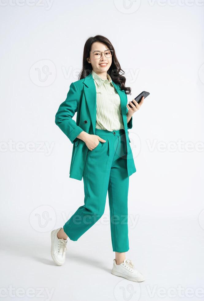 Image of young Asian business woman on background photo