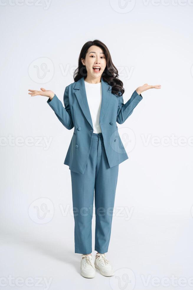 Image of young Asian business woman on background photo