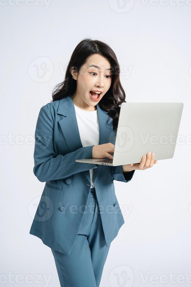 Image of young Asian business woman on background photo