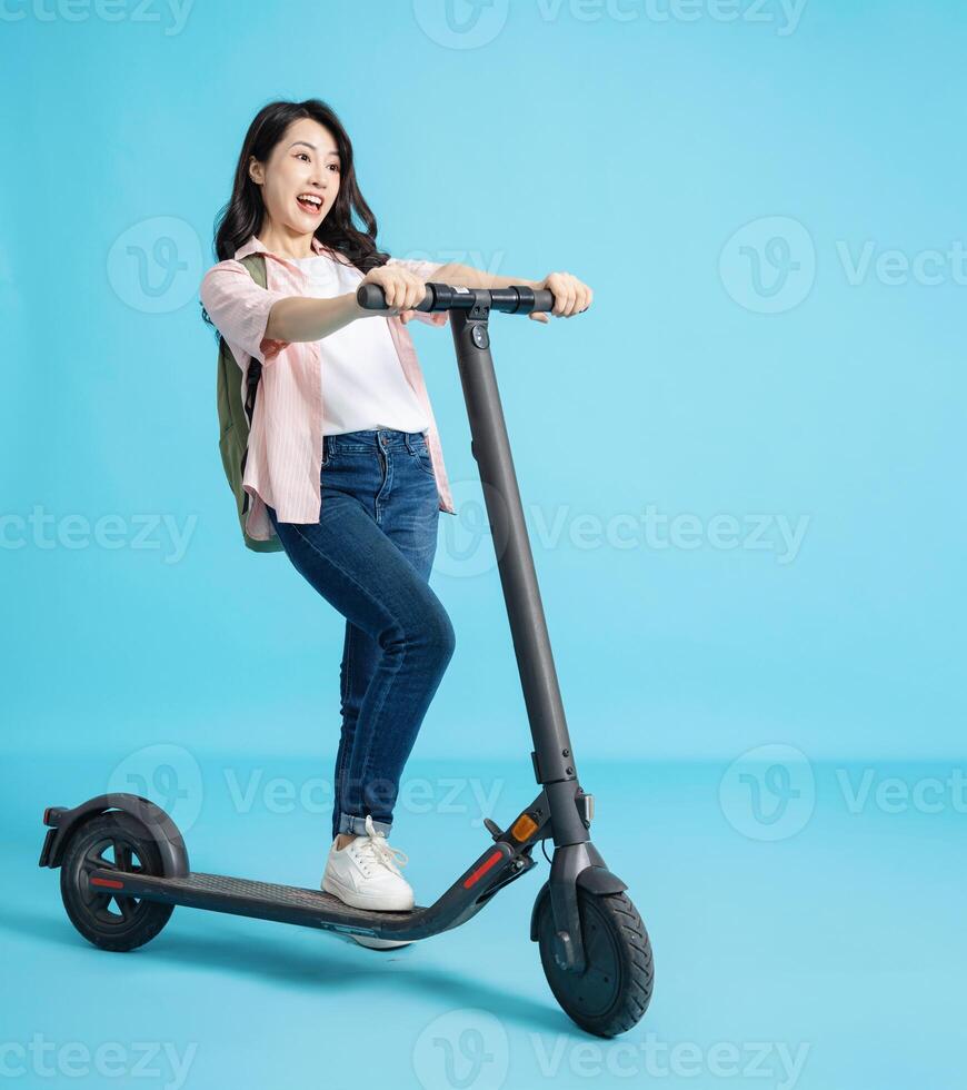 Photo of young Asian woman on background