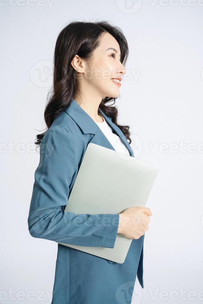 Image of young Asian business woman on background photo