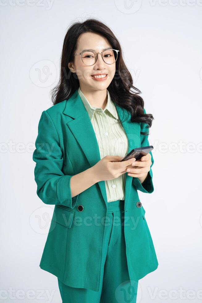 Image of young Asian business woman on background photo