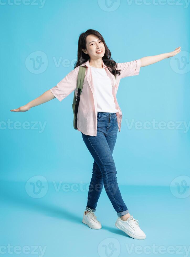 Photo of young Asian woman on background