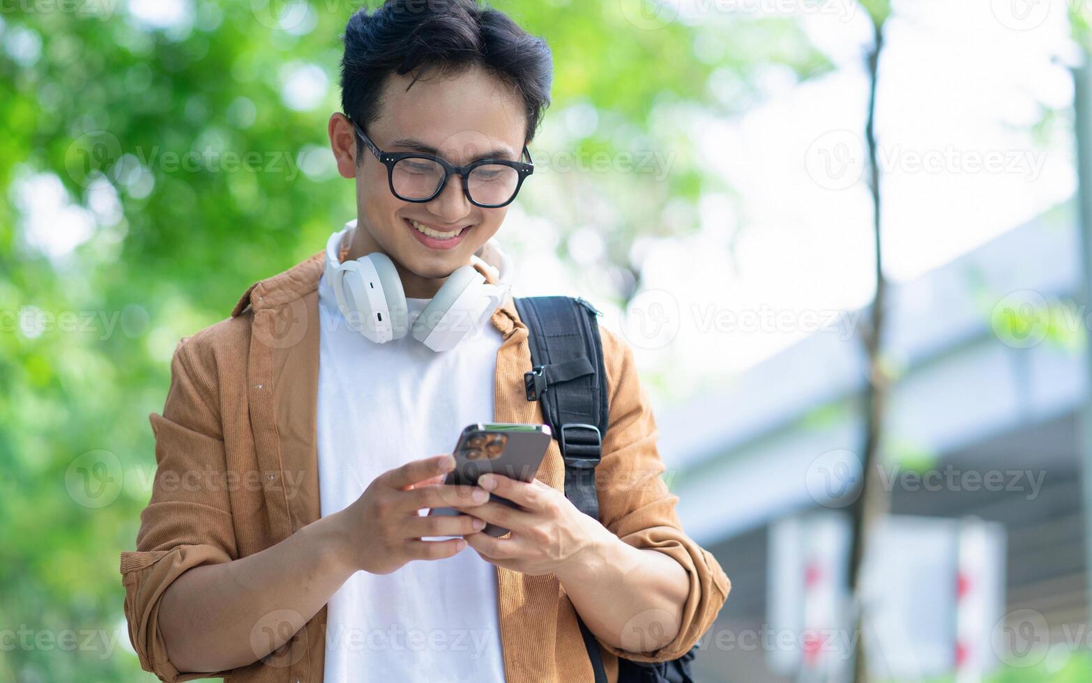 Portrait of young Asian man outside photo