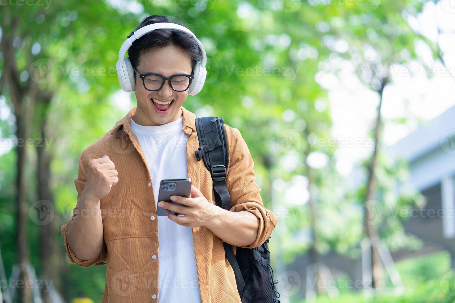 Portrait of young Asian man outside photo