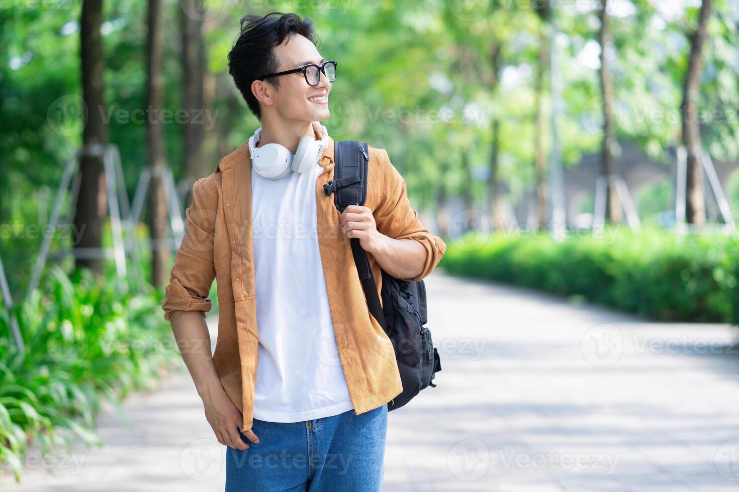 Portrait of young Asian man outside photo