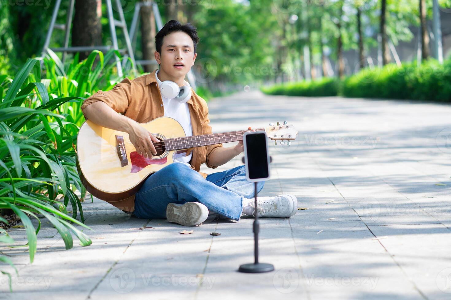 Portrait of young Asian man outside photo